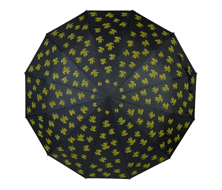 Black umbrella with yellow Corroboree Frogs, seen from above against white background.