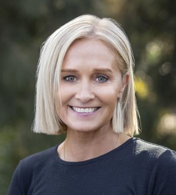 Erin Lightfoot looking the camera, smiling.