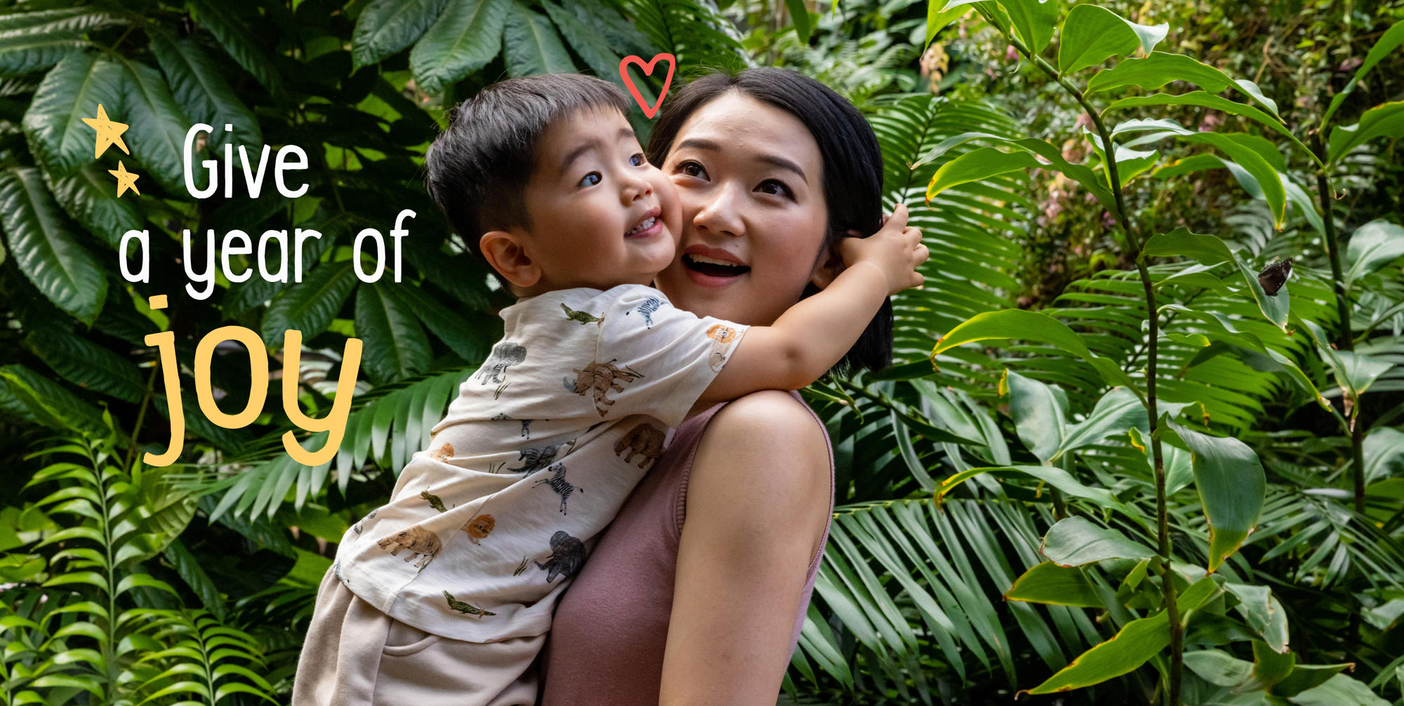 "Give a year of joy": A young guest embraces his mother in the Butterfly House.