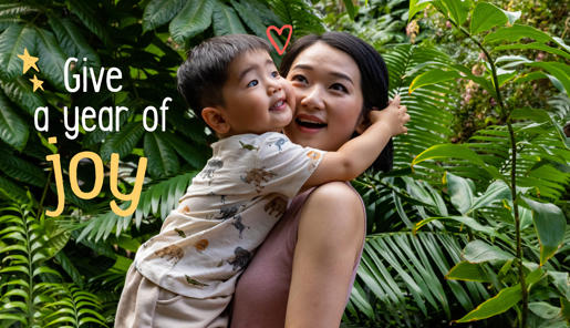 "Give a year of joy": A young guest embraces his mother in the Butterfly House.