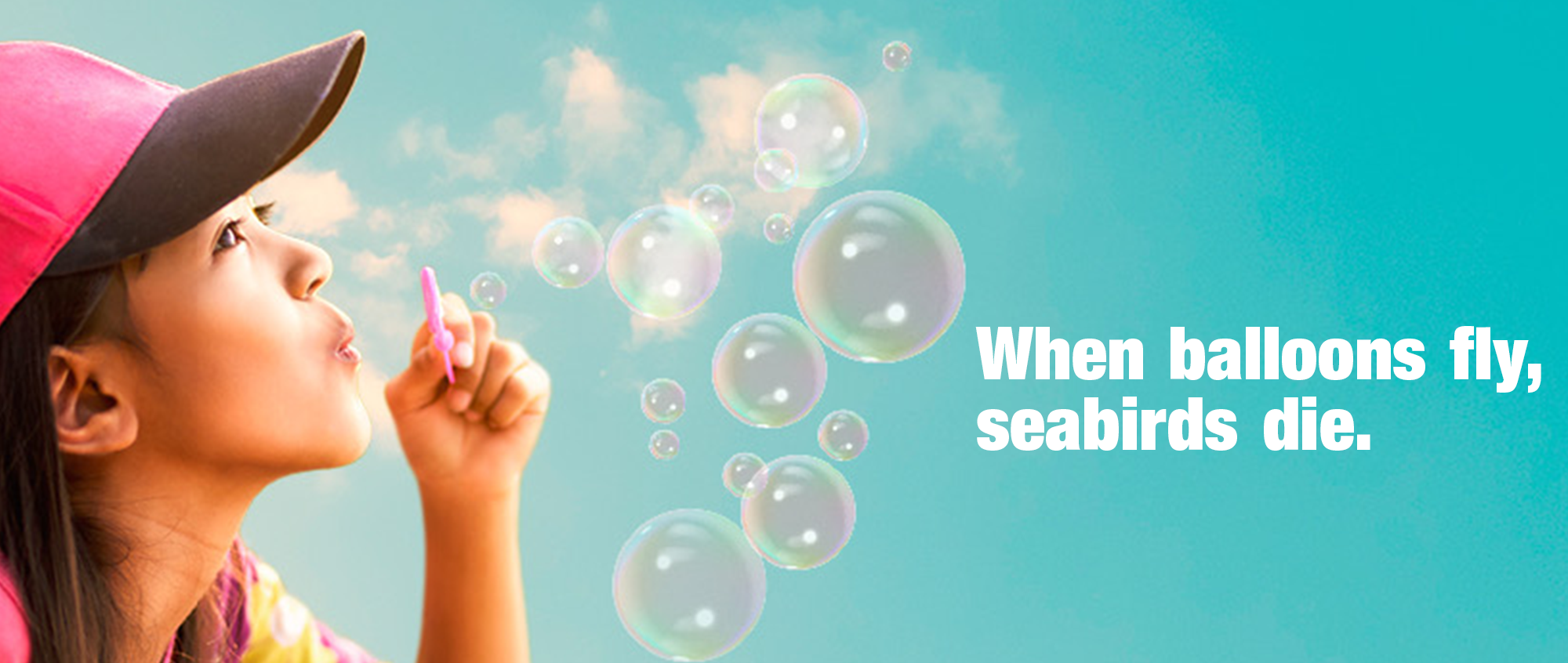 "When Balloons Fly, Seabirds Die" - A side profile of a woman blowing bubbles, left of the slogan, against a turquoise sky.