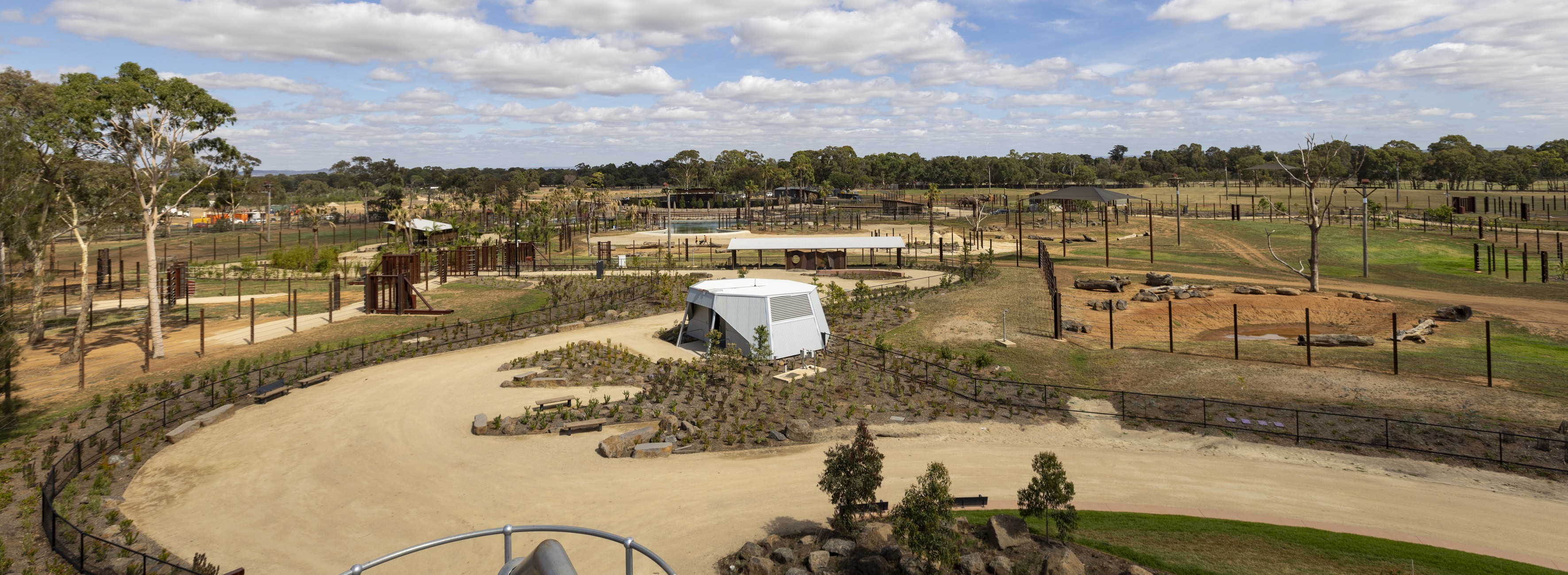 A view of the new Elephant Trail, towards the Elephant Café, beneath an overcast sky.