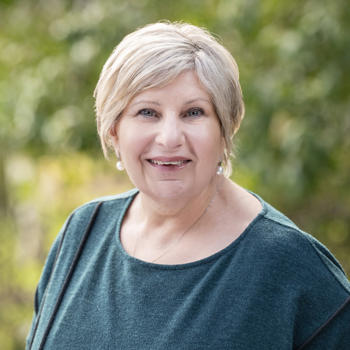 The Honourable Marsha Thomson, looking at the camera and smiling.