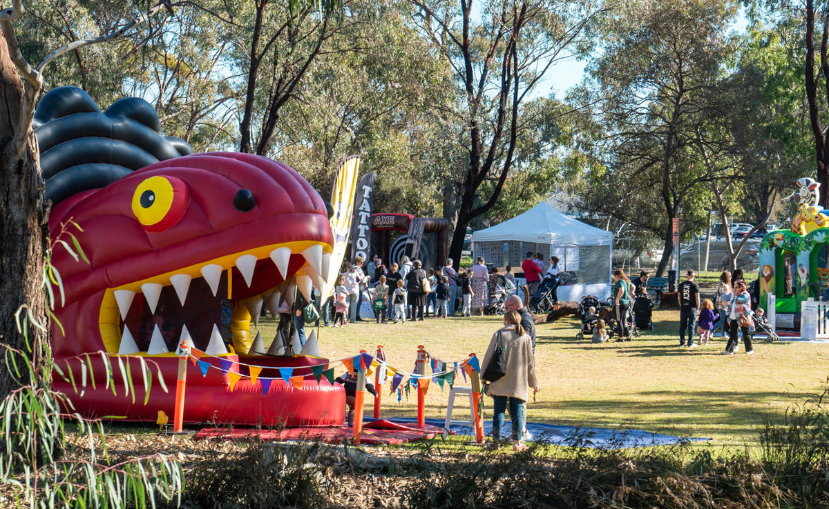 Visitors enjoying Wild Weekender at Kyabram Fauna Park, with giant bounce castle