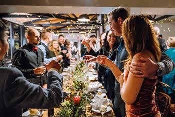 View of a crowded buffet table at an event in the Bong Su Room.