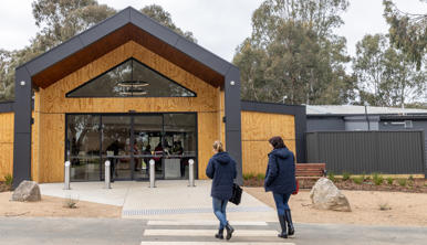 Two women walking into the Entrance of Kyabram Fauna Park.