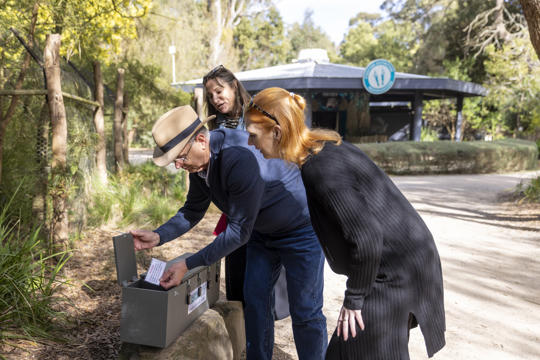 Race Around the Zoo marketing images. Three adults participating in the RATZ threatened species experience. Staff and volunteers as talent.