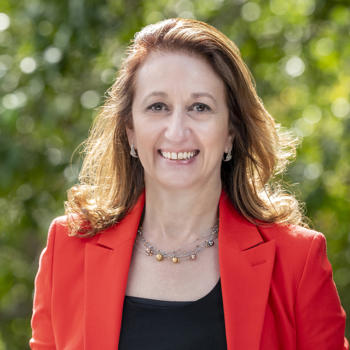 Doctor Teresa De Fazio, OAM, looking at the camera and smiling.
