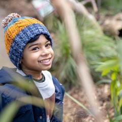 A boy looking up at a Bird, off-frame.