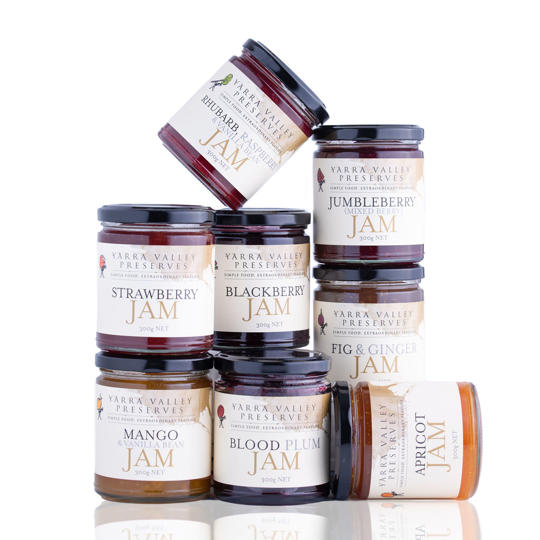 Stack of eight unopened "Yarra Valley Preserves" jars of assorted jams, against a white background.