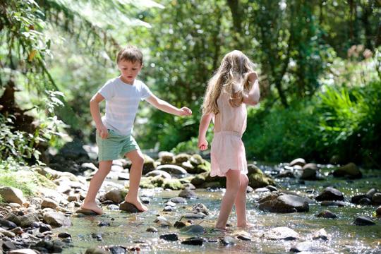 Two kids playing at the Creek.