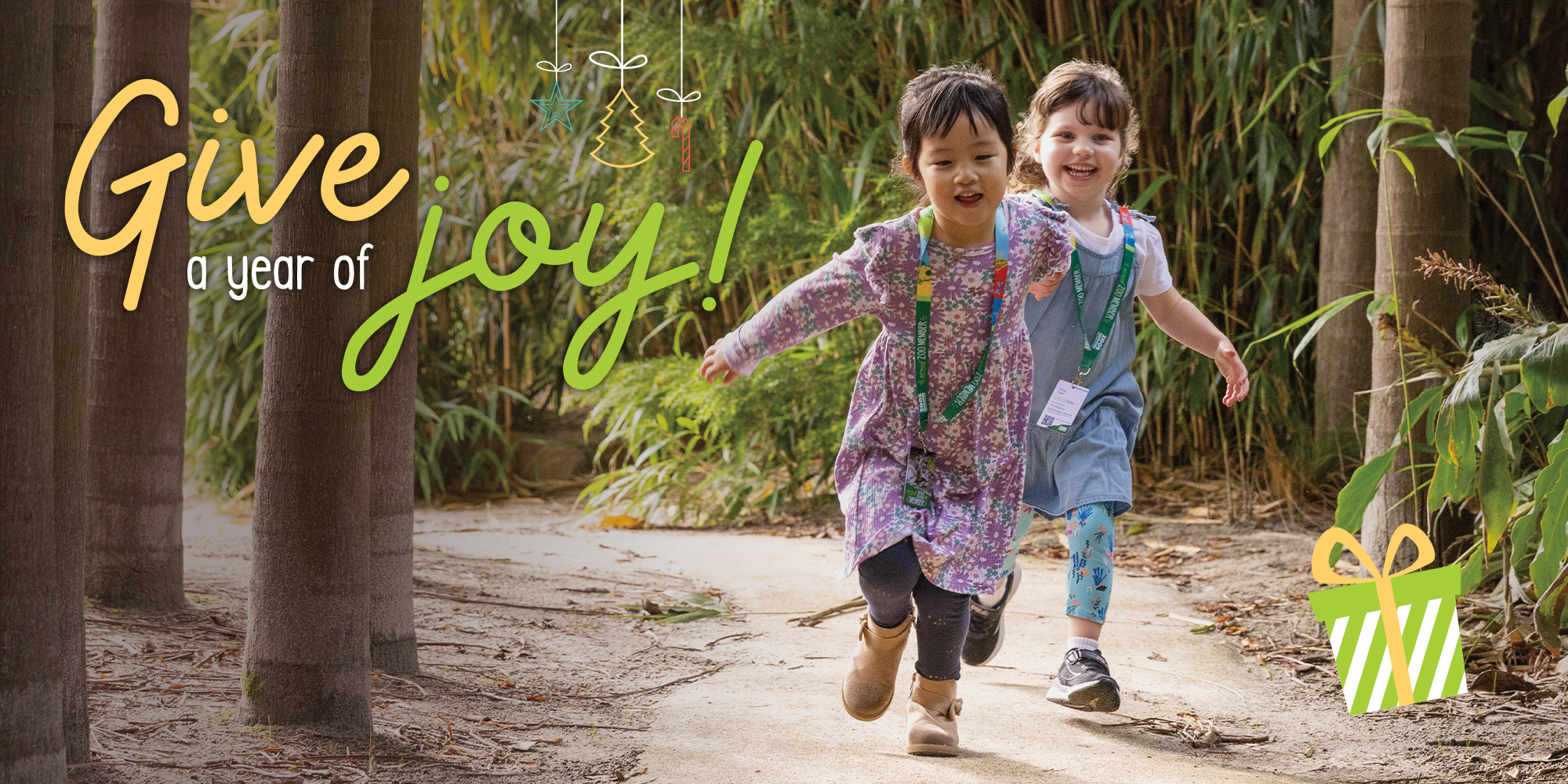 "Give a year of joy!" - Two young guests running through the Bamboo Forest, toward the camera.